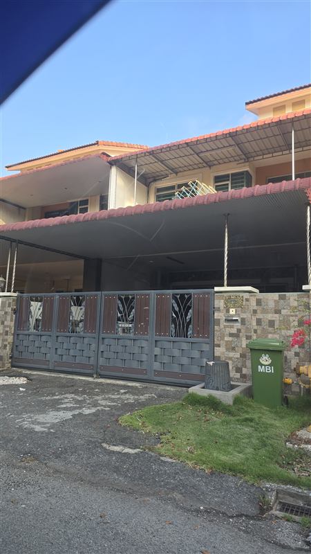 Sliding gate with timber-look slats and laser-cut panels at a terrace house